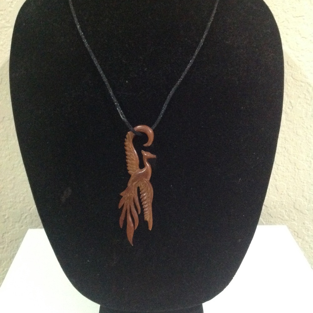 Hand carved pendant BIRD OF PARADISE